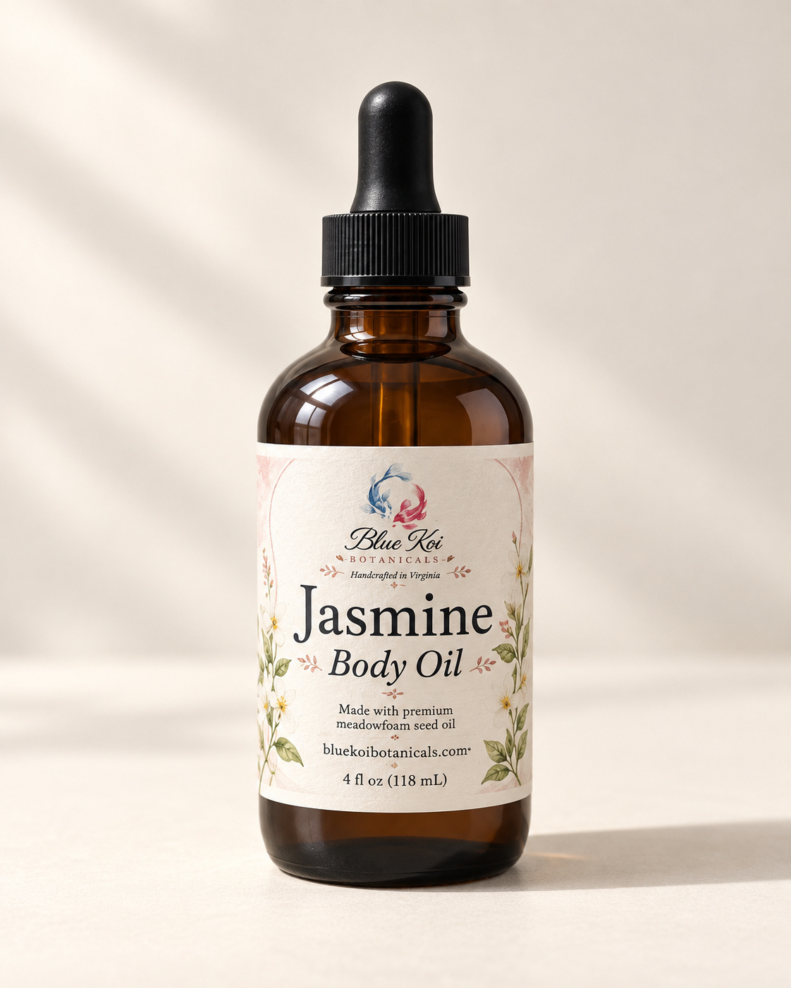 Blue Koi Jasmine Body Oil in an amber glass bottle