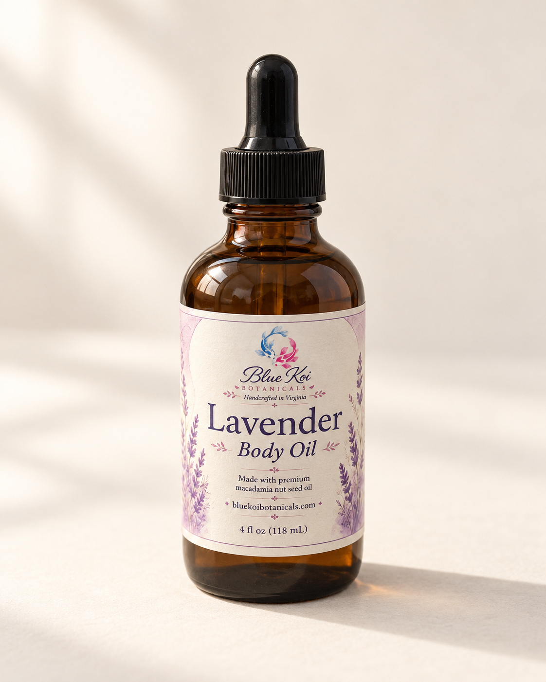 Blue Koi Lavender Body Oil in an amber glass bottle